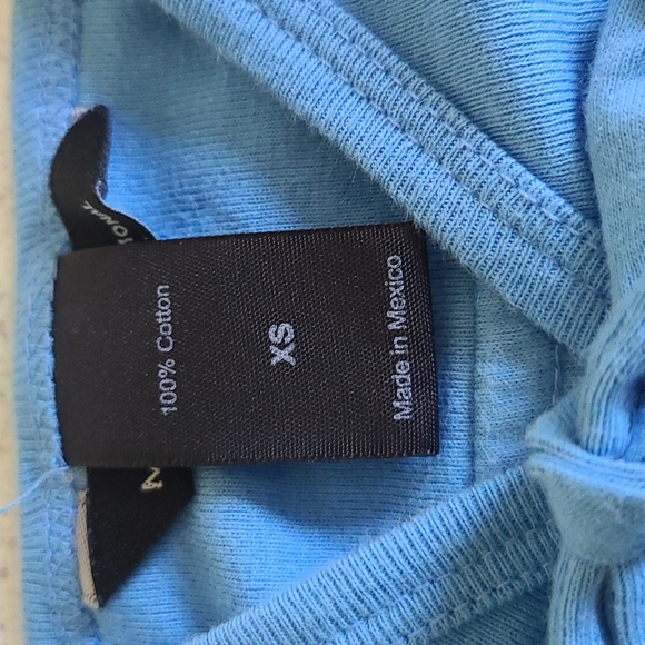 2/$25 Pretty sky-blue flowy top. Xsmall in New condition. - Picture 2 of 4